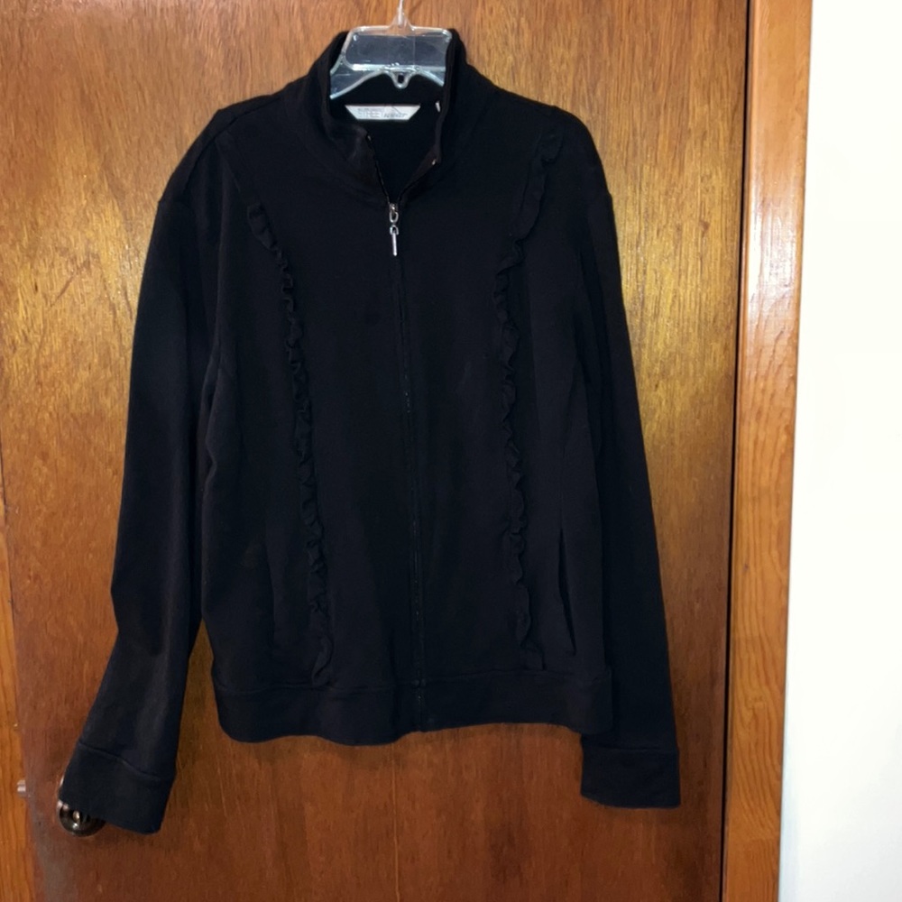 Black zip up women’s sweat jacket.